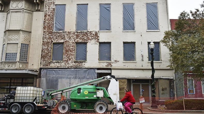 Two Hamilton building are seeing a flurry of construction activity, one of them for a new restaurant on the bottom floor with apartments above and the other for the installation of an elevator. The projects have a Hamilton road shut down as crews work on both endeavors.