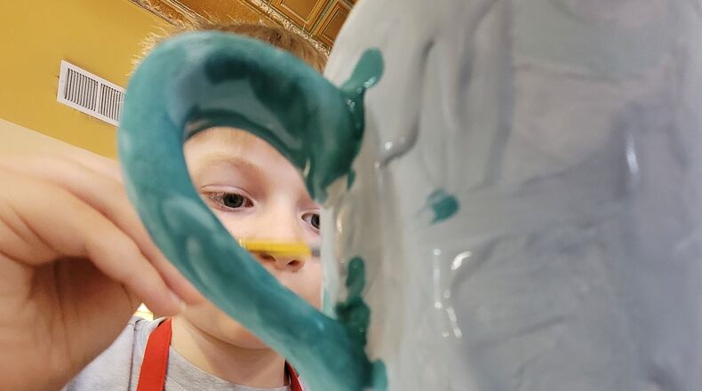 Dean Baker, 9, enjoyed painting at The Studio on Thursday. The Studio soon will be moving four blocks west to 547 Main St., and should open there Sept. 17. NICK GRAHAM/STAFF