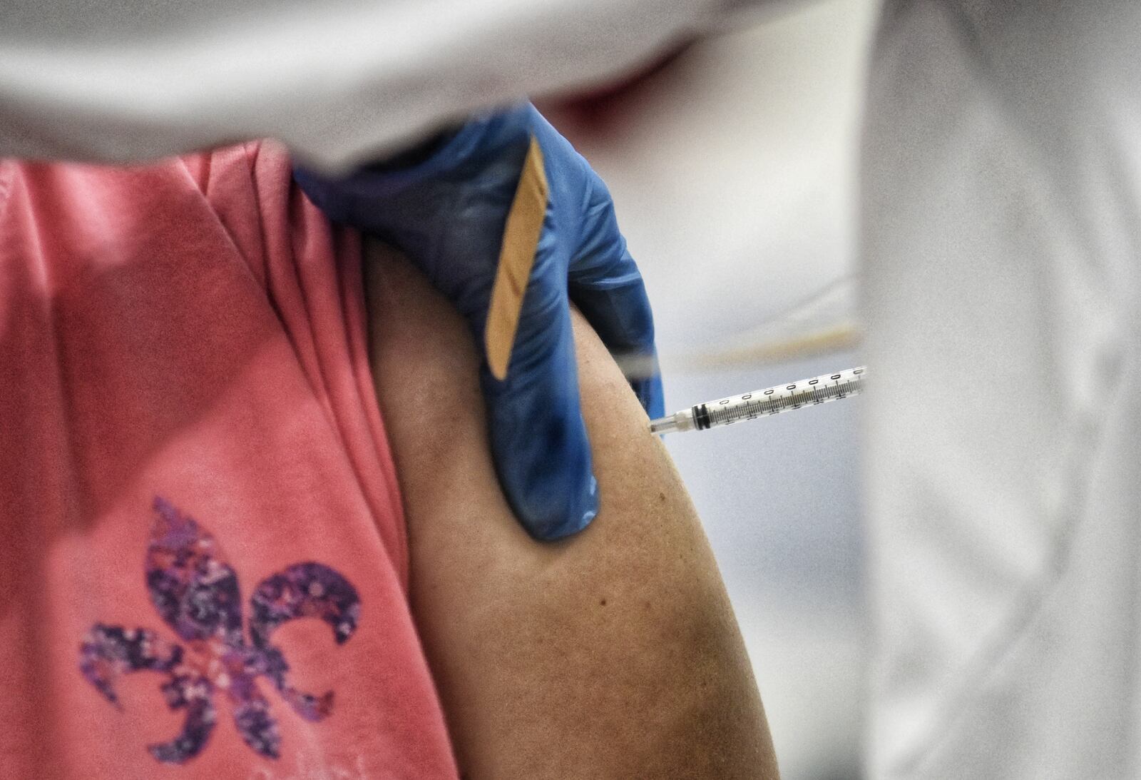 School faculty lined up for Covid-19 vaccines administered by Kroger Wednesday, February 3, 2021 at Lakota West High School in West Chester Township. NICK GRAHAM / STAFF
