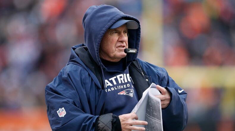 FILE - In this Dec. 15, 2019, file photo, New England Patriots coach Bill Belichick stands on the sideline during the second half of the team's NFL football game against the Cincinnati Bengals in Cincinnati. The Patriots have been fined $1.1 million by the NFL for inappropriately filming the Cincinnati Bengals’ sideline during a game last season. On Sunday, June 28, 2020, the league also took away a third-round pick in the 2021 draft. “I personally have never viewed any video footage at all, anything that those production people have done, other than what’s shown on public television or something like that,” Belichick said in December.