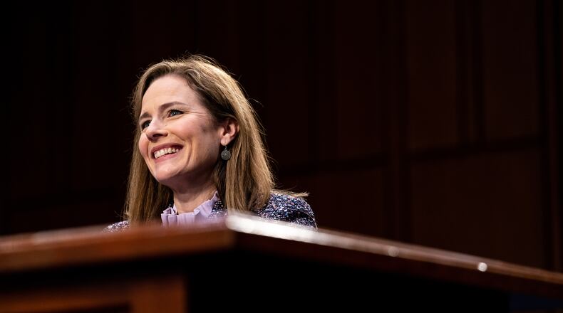 Judge Amy Coney Barrett was confirmed on Monday to the Supreme Court, capping a lightning-fast Senate approval that handed President Trump a victory ahead of the election and promised to tip the court to the right for years to come. (Erin Schaff/The New York Times)