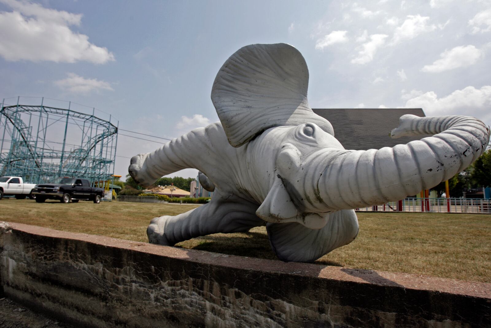 A fiberglass elephant lies on the side of a drained lake in 2006 after LeSourdsville Lake employees removed it from the closed amusement park.