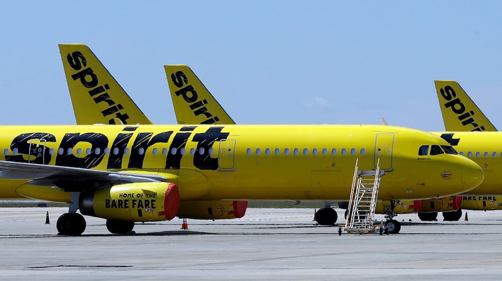 FLE - A line of Spirit Airlines jets sit on the tarmac at the Orlando International Airport on May 20, 2020, in Orlando, Fla. (AP Photo/Chris O'Meara, File)