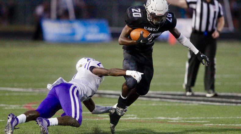 Lakota East’s Josh Thornhill runs the ball during Friday night’s game vs. Middletown. Nick Graham/STAFF