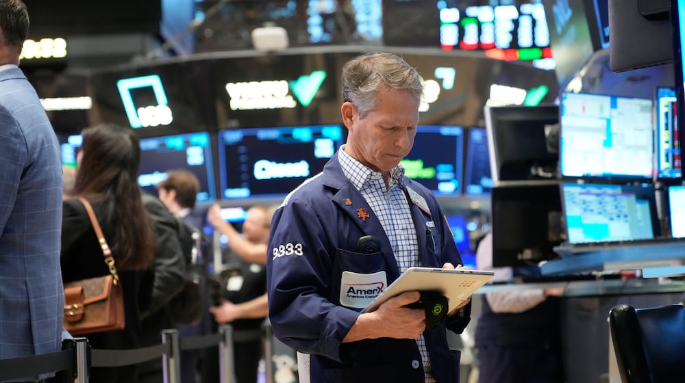 Bobby Charmak works on the floor at the New York Stock Exchange in New York, Friday, March 6, 2026. (AP Photo/Seth Wenig)