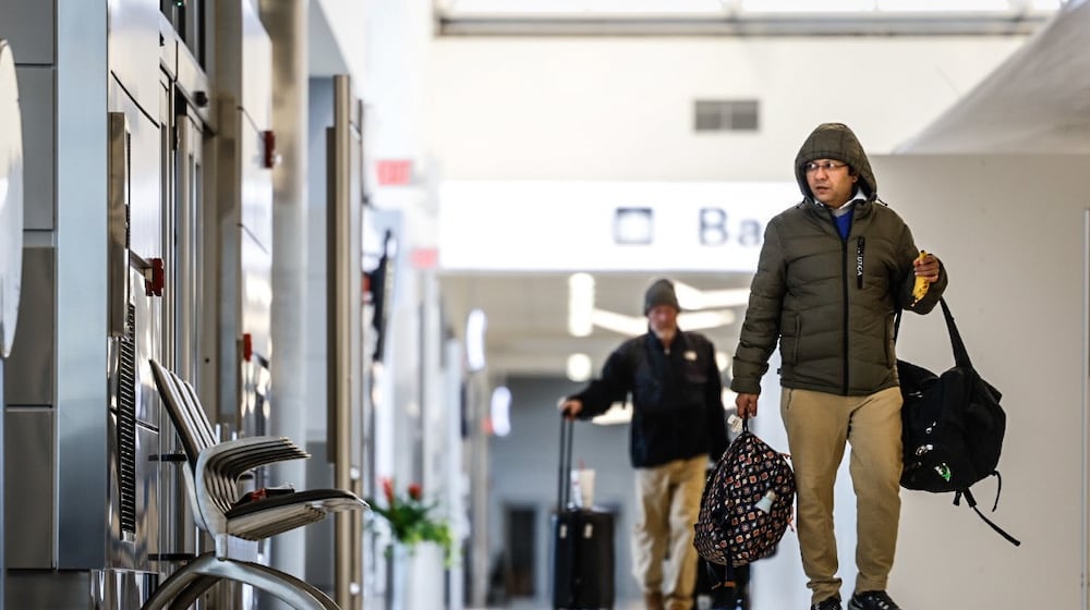 Travelers at the Dayton International Airport walk to the TSA check point in 2022. FILE