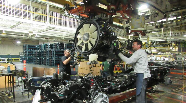 Workers at Moraine-based DMAX, working on Duramax diesel engines. CONTRIBUTED