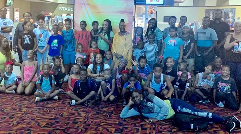 A hundred local children and 34 adult chaperons attended a free screening of "The Lion King." The event was part of a partnership between Dayton Young Black Professionals, McKinley United Methodist Church, The Dayton Foundation, CityWide Development Corporation and the Gem City Market.