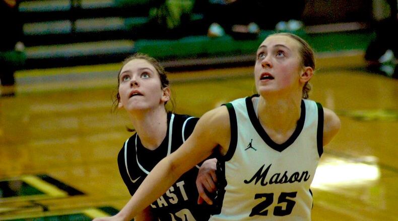 Mason's Becca Sanders (25) boxes out Lakota East's Addyson Johnson (10) on Saturday afternoon at Mason Middle School. Chris Vogt/CONTRIBUTED