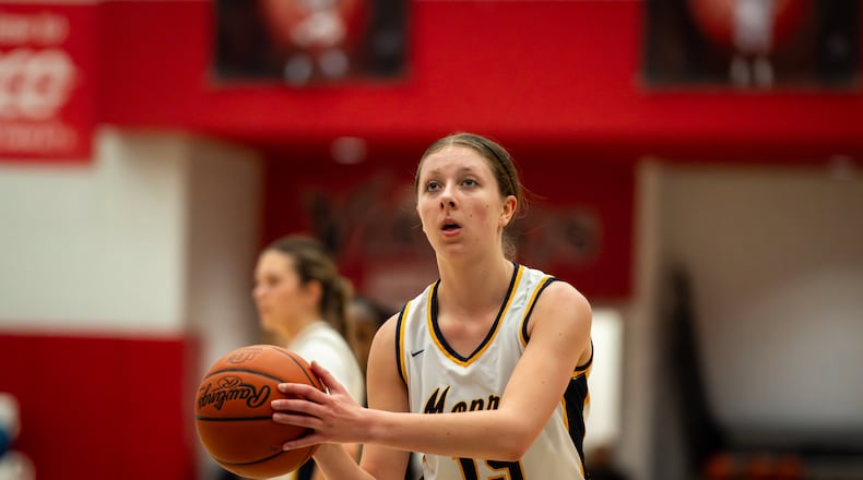 Monroe’s Ryan Buskirk eyes a free-throw attempt during her Division III tournament game against Mount Healthy on Thursday night at Princeton. AJ FULLAM / CONTRIBUTED