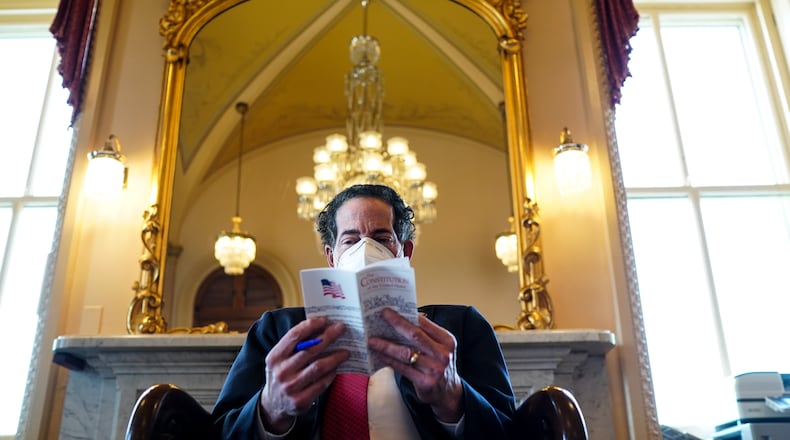 Lead House impeachment manager Rep. Jamie Raskin (D-Md.), reviews a copy of the U.S. Constitution while meeting with other impeachment managers at the Capitol in Washington, Tuesday, Feb. 9, 2021, as they prepare for the second impeachment trial of former President Donald Trump. The second impeachment trial of former President Trump is scheduled to begin on Tuesday, about a month after he was charged by the House with incitement of insurrection for his role in egging on a violent mob that stormed the Capitol on Jan. 6. (Erin Schaff/The New York Times)