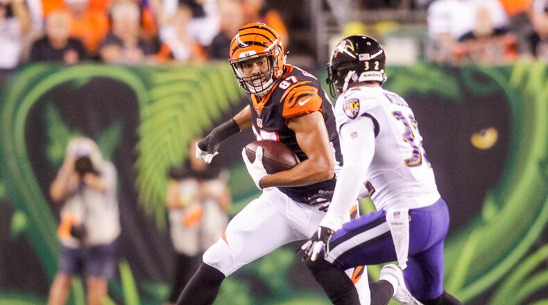 Cincinnati Bengals C.J. Uzomah carries the bal lafter making a catch during their game against the Baltimore Ravens Thursday, Sept. 13 at Paul Brown Stadium in Cincinnati. The Cincinnati Bengals defeated the Baltimore Ravens 34-23. NICK GRAHAM/STAFF