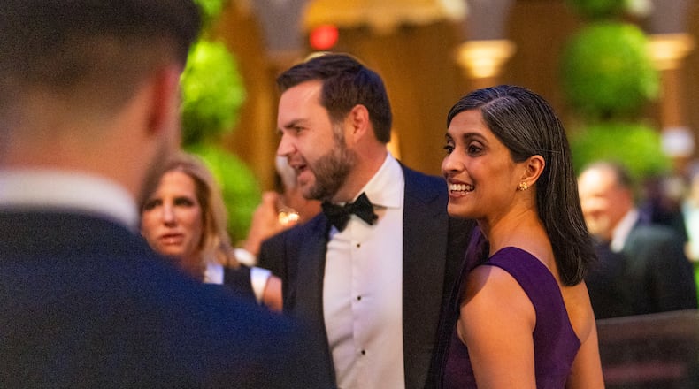 Vice President-elect JD Vance and his wife Usha Vance speak to attendees while they wait for President-elect Donald Trump’s arrival during a candlelight dinner at the National Building Museum in Washington on Sunday, Jan. 19, 2025, the day before Trump’s inauguration. (Doug Mills/The New York Times)