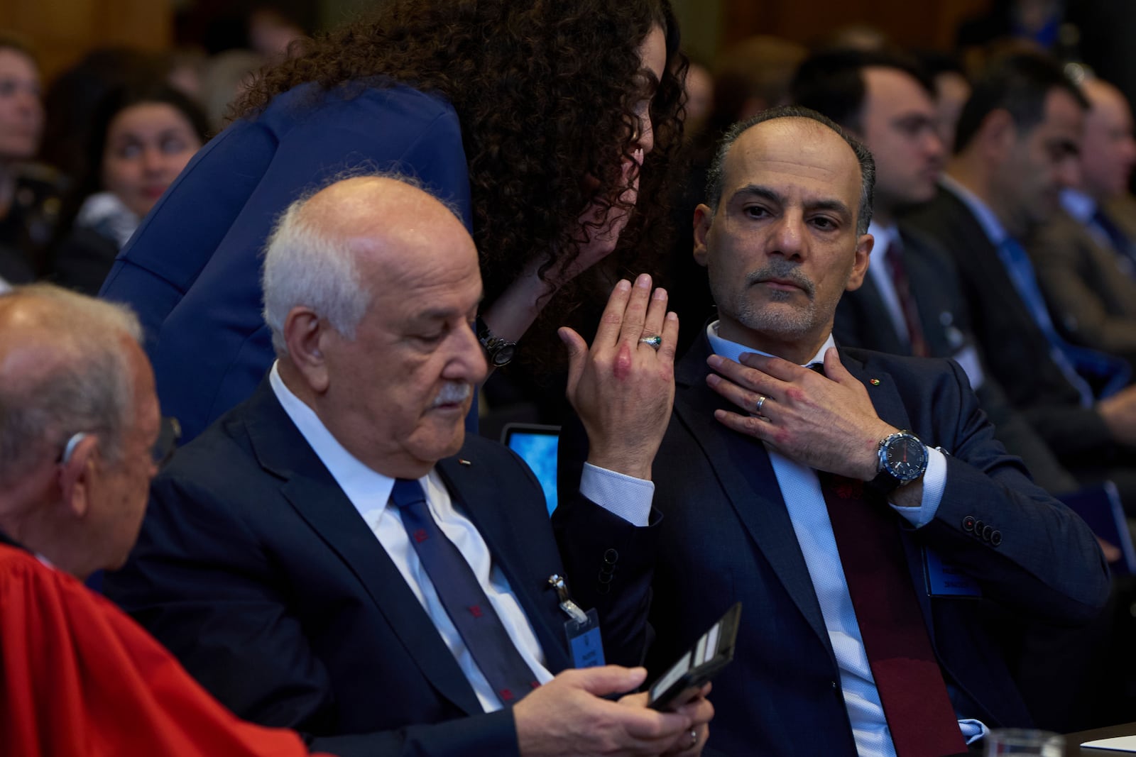 Palestinian Ambassadors to the United Nations Ammar Hijazi, right, Riyad Mansour, second left, and other members of the legal team wait for the International Court of Justice to open hearings into a United Nations request for an advisory opinion on Israel's obligations to allow humanitarian assistance in Gaza and the West Bank, in The Hague, Netherlands, Monday, April 28, 2025. (AP Photo/Peter Dejong)