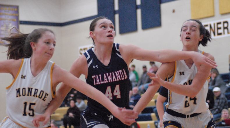 Talawanda's Kylee Fears (44) looks to hit the boards against Monroe's Ryan Buskirk (15) and Macy Creekbaum (24) during the game at Monroe on Thursday. Chris Vogt/CONTRIBUTED