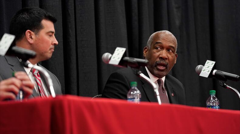 COLUMBUS, OH - DECEMBER 04:  Offensive coordinator Ryan Day of the Ohio State Buckeyes listens as athletics director Gene Smith answers a question during a press conference at Ohio State University on December 4, 2018 in Columbus, Ohio. At the press conference head coach Urban Meyer announced his retirement and Day was announced as the next head coach. Meyer will continue to coach until after the Ohio State Buckeyes play in the Rose Bowl. (Photo by Kirk Irwin/Getty Images)