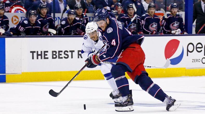 COLUMBUS, OH - APRIL 16: Scott Harrington #4 of the Columbus Blue Jackets and Mathieu Joseph #7 of the Tampa Bay Lightning chase after the puck during the first period of Game Four of the Eastern Conference First Round during the 2019 NHL Stanley Cup Playoffs on April 16, 2019 at Nationwide Arena in Columbus, Ohio. (Photo by Kirk Irwin/Getty Images)