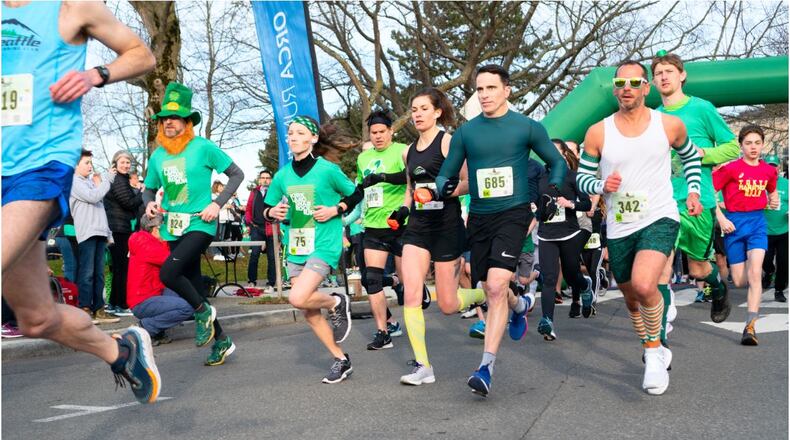 Kirkland Washington, March 16 2019. Kirkland shamrock run, a fun-filled road race celebrating Kirkland, healthy living, and St. Patrick's Day. 5k runners just off the start.