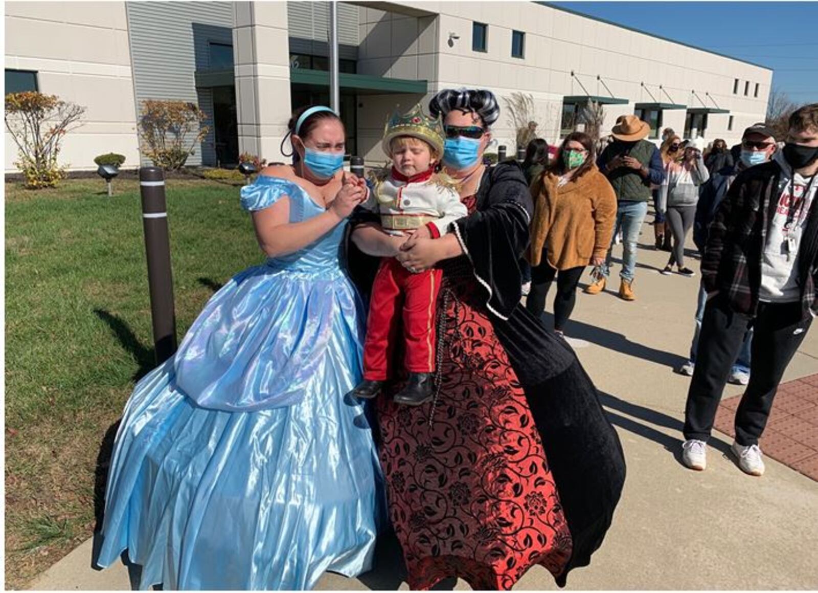 Silvia Erskine, right, son Elliot, and Ashley Erskine, all of Oxford, wore their Halloween costumes as they stood in line to vote early Saturday at the Butler County Board of Elections. ED RICHTER/STAFF