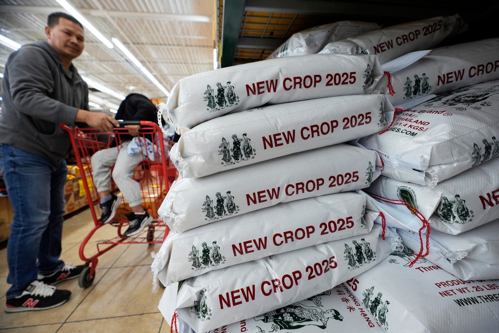 Imported bags of rice sit for sale at the Hiep Thai grocery store in Garland, Texas, Monday, April 7, 2025. (AP Photo/LM Otero)