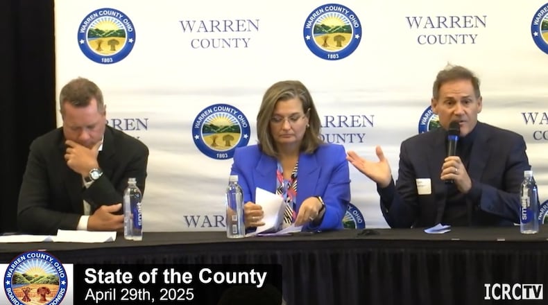 Warren County Commission President Tom Grossman, right, speaks during the State of the County address April 29, 2025, at Shaker Run Golf Club in Turtlecreek Twp. Also seated are Commissioners David Young, left, and Shannon Jones. CONTRIBUTED