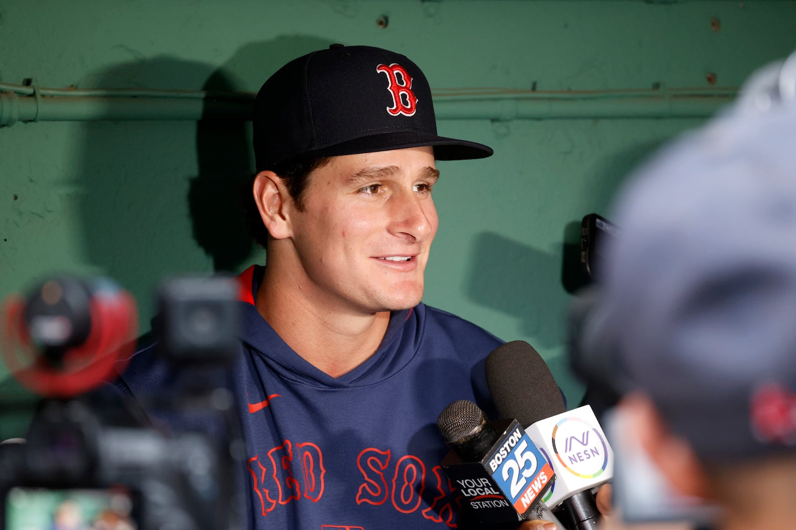 Boston Red Sox outfielder Roman Anthony speaks with the media in the dugout before making his first major league start in a baseball game against the Tampa Bay Rays at Fenway Park, Monday, June 9, 2025, in Boston. (AP Photo/Mary Schwalm)
