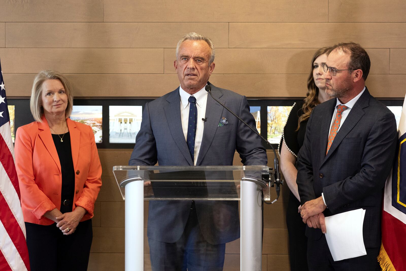 Health and Human Services Secretary Robert F. Kennedy Jr., center, speaks during a press conference about Utah's new fluoride ban, food additives and SNAP funds legislation, Monday, April 7, 2025, in Salt Lake City. (AP Photo/Melissa Majchrzak)