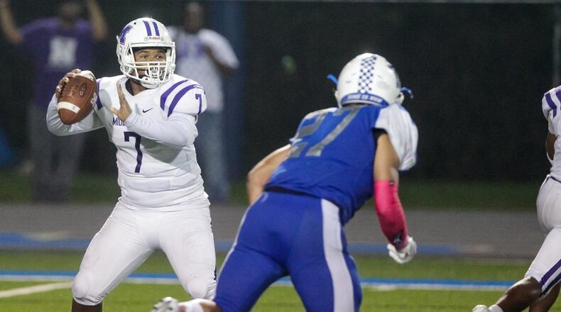 Middletown’s Kamari Fuller looks for an open man during their game against Hamilton Friday, Oct. 5 at Virgil M. Schwarm Stadium at Hamilton High School in Hamilton. Hamilton won 15-14. NICK GRAHAM/STAFF