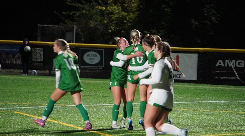 The Badin High School girls soccer celebrates after Lydia Kemper (10) scored a goal against McNicholas in a Division III regional semifinal on Tuesday at Centerville. CHRIS VOGT / CONTRIBUTED