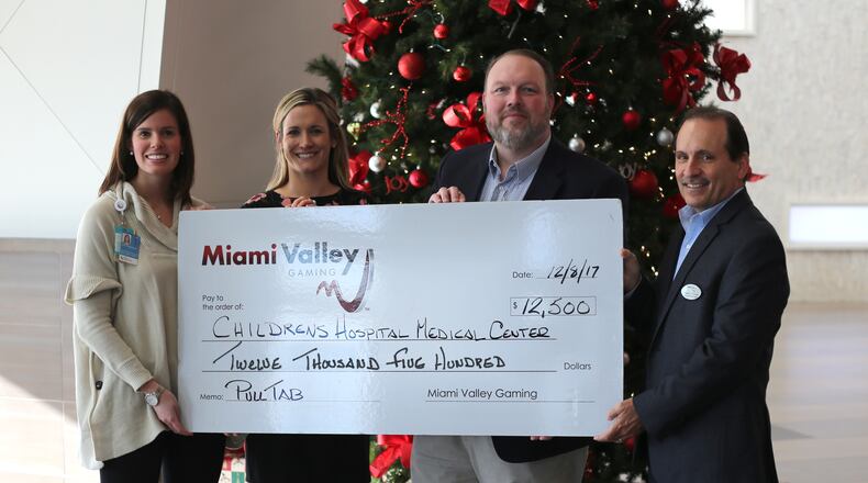 Miami Valley Gaming raised $12,500 in December with a charity pull tab promotion that benefited Cincinnati Children’s Hospital Medical Center. MVG President and General Manager Domenic Mancini (far right) and MVG Director of Marketing Jerry Abner presented the check to Cincinnati Children’s Donor Relations Officer Jane Livingston and Cincinnati Children’s Director of Special Events, Stewardship and Corporate Relations Kerri Finke.