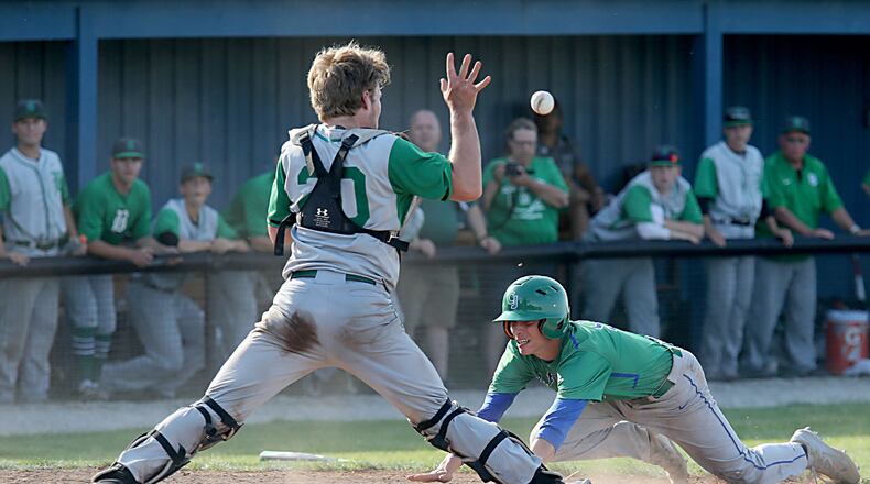 Badin catcher Zac Wilson takes the throw as Chaminade Julienne’s Cameron Benoit scores the winning run in the bottom of the seventh inning Thursday during a Division II sectional final at Miamisburg. CONTRIBUTED PHOTO BY E.L. HUBBARD