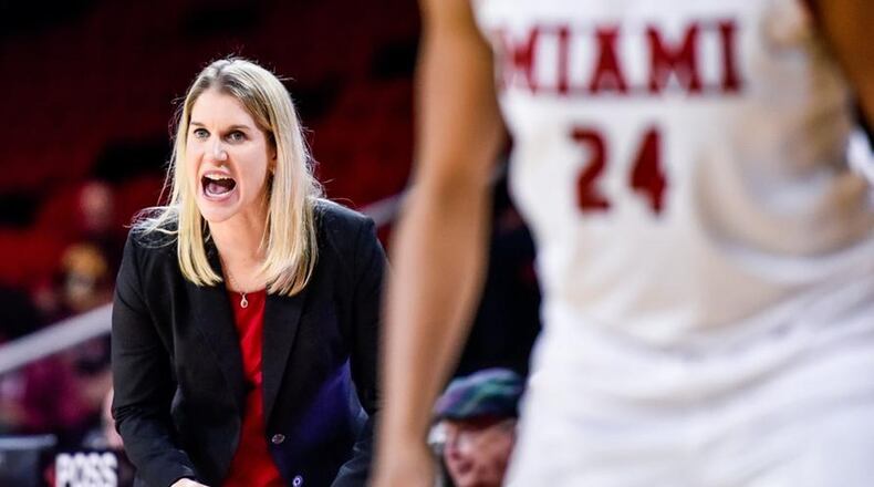 Miami University coach Megan Duffy makes a point to her team during a WNIT game against Duquesne at Millett Hall in Oxford on March 15, 2018. NICK GRAHAM/STAFF