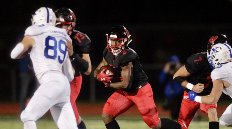 Lakota West's Joshua Brogden runs the ball against St. Xavier in Friday's Division I regional final at West. Nick Graham/STAFF