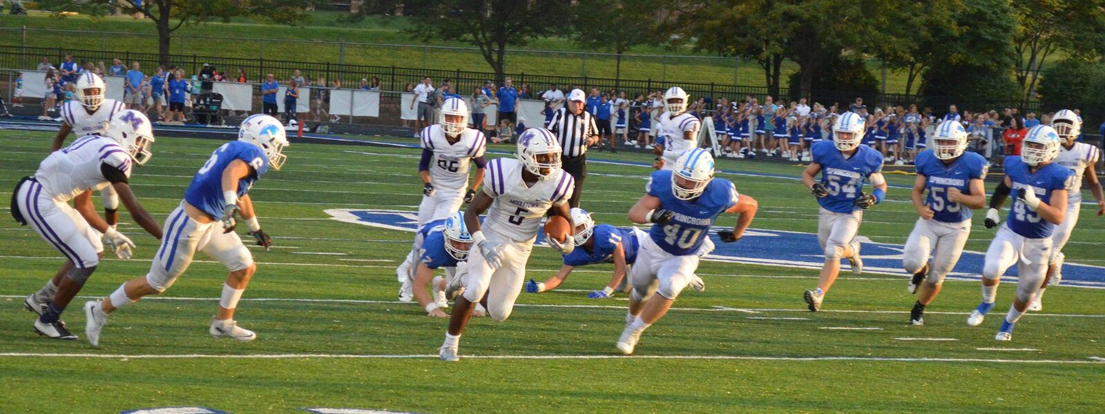 Middletown’s Josh Bryant (5) is chased by Lincoln Troxell (40) of Springboro during Friday night’s game at CareFlight Field in Springboro. CONTRIBUTED PHOTO BY ERIC FRANTZ