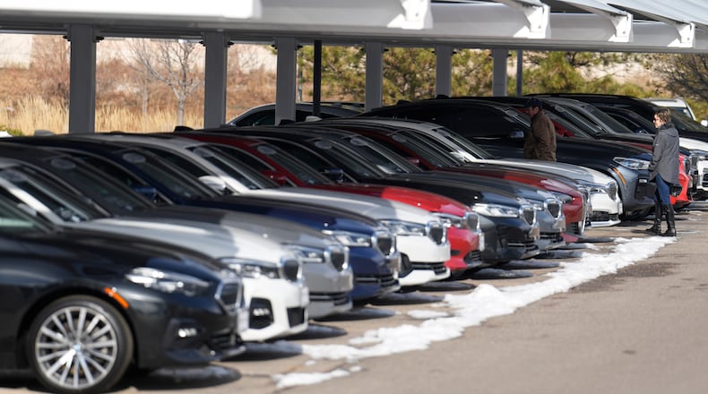 FILE - Unsold 2023 and 2024 models sit on display outside a BMW dealership on Thursday, Nov. 30, 2023, in Loveland, Colo. (AP Photo/David Zalubowski, File)
