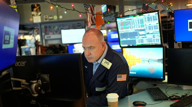 Derek Orth works on the floor at the New York Stock Exchange in New York, Wednesday, Dec. 10, 2025. (AP Photo/Seth Wenig)
