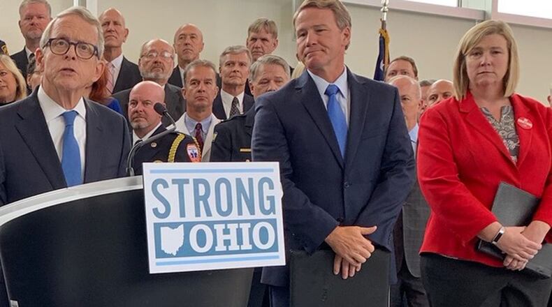 Gov. Mike DeWine announces his Strong Ohio gun bill plan Monday, Oct. 7, 2019, in Columbus. Lt. Gov. Jon Husted and Dayton Mayor Nan Whaley are to his right. Photo by Laura Bischoff