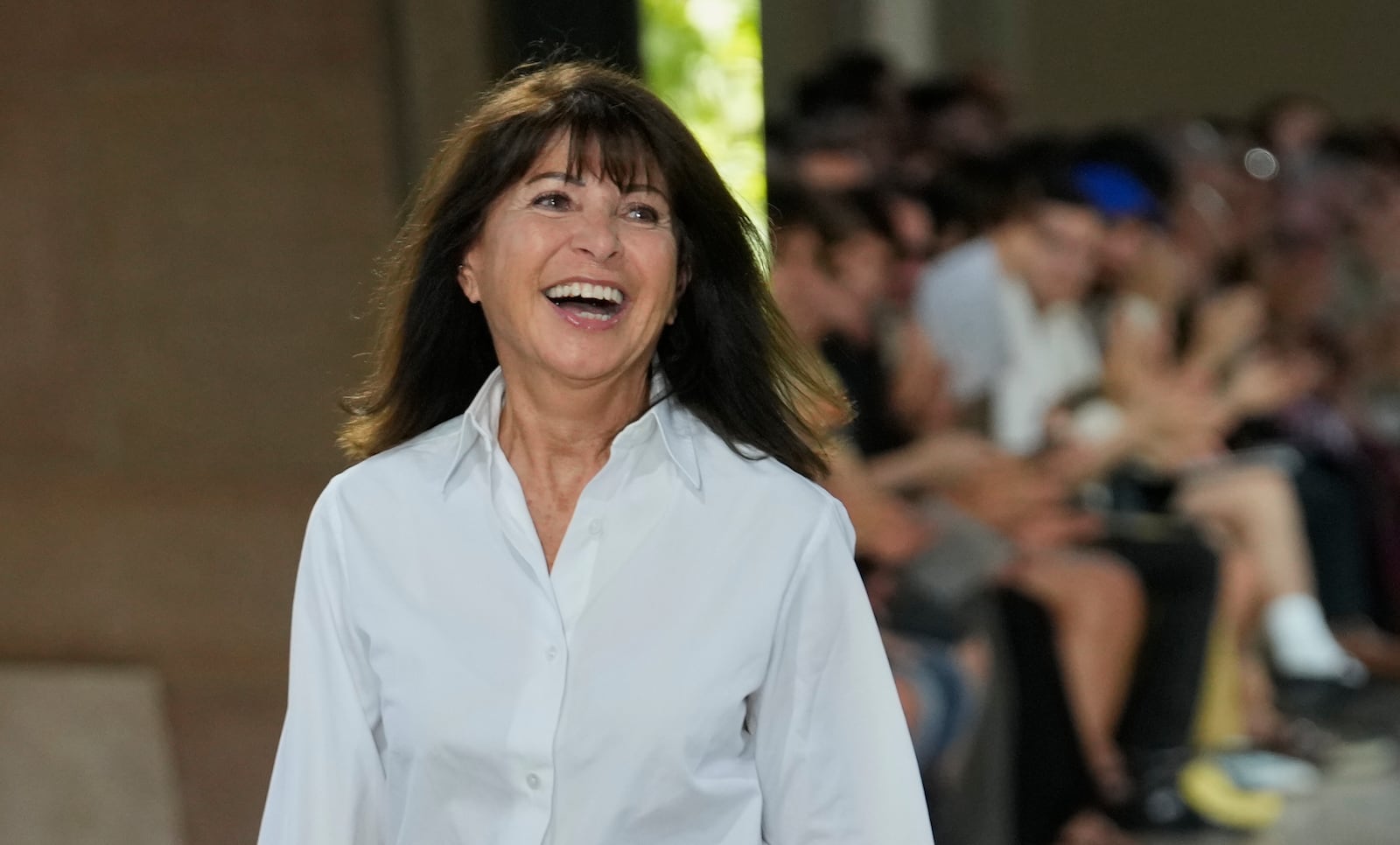 Fashion designer Veronique Nichanian acknowledges applause after the presentationof the men's Hermes Spring-Summer 2026 collection, that was presented in Paris Saturday, June 28, 2025. (AP Photo/Michel Euler)