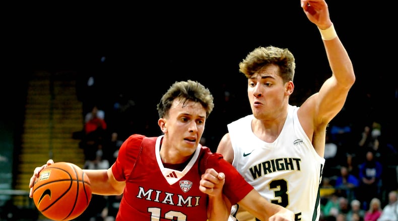 Miami's Ryan Mabrey drives past Wright State's Alex Huibregtse at the Nutter Center on Tuesday, Dec. 19, 2023. DAVID A. MOODIE/CONTRIBUTING PHOTOGRAPHER