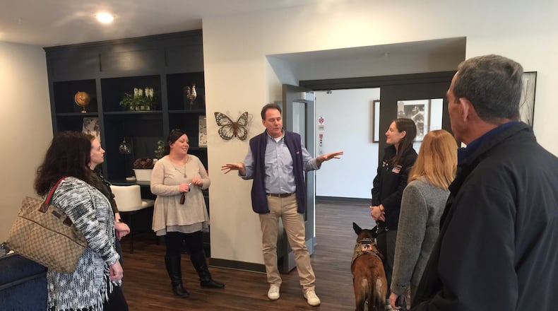 CMC Properties President Jim Cohen, center, met with Middletown City Council members, city staff and some key stakeholders as they toured The Marcum Apartments in downtown Hamilton on Thursday. Council is exploring the possibility of recreating such an apartment complex on the former Swallen’s/city garage site on Verity Parkway. ED RICHTER/STAFF