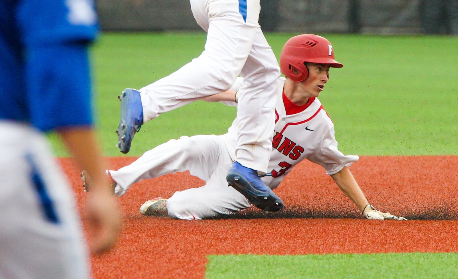 Fairfield’s Noah Bauman (3) is forced out at second base during Thursday’s Division I regional semifinal against St. Xavier at the University of Cincinnati’s Marge Schott Stadium. GREG LYNCH/STAFF