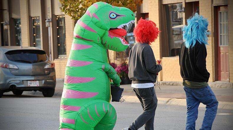 The New Carlisle Farmer's Market hosted the Halloween Night Market on Saturday in downtown New Carlisle. Patrons enjoyed trick-or-treating, food, a pumpkin-carving contest, vendors, and a movie. MARSHALL GORBY/STAFF