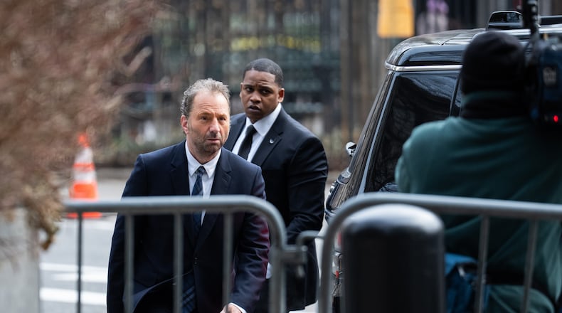 Michael Rapino, left, chief executive officer and president of Live Nation Entertainment Inc., arrives at Manhattan Federal court, Thursday, March 19, 2026 in New York. (AP Photo/Adam Gray)