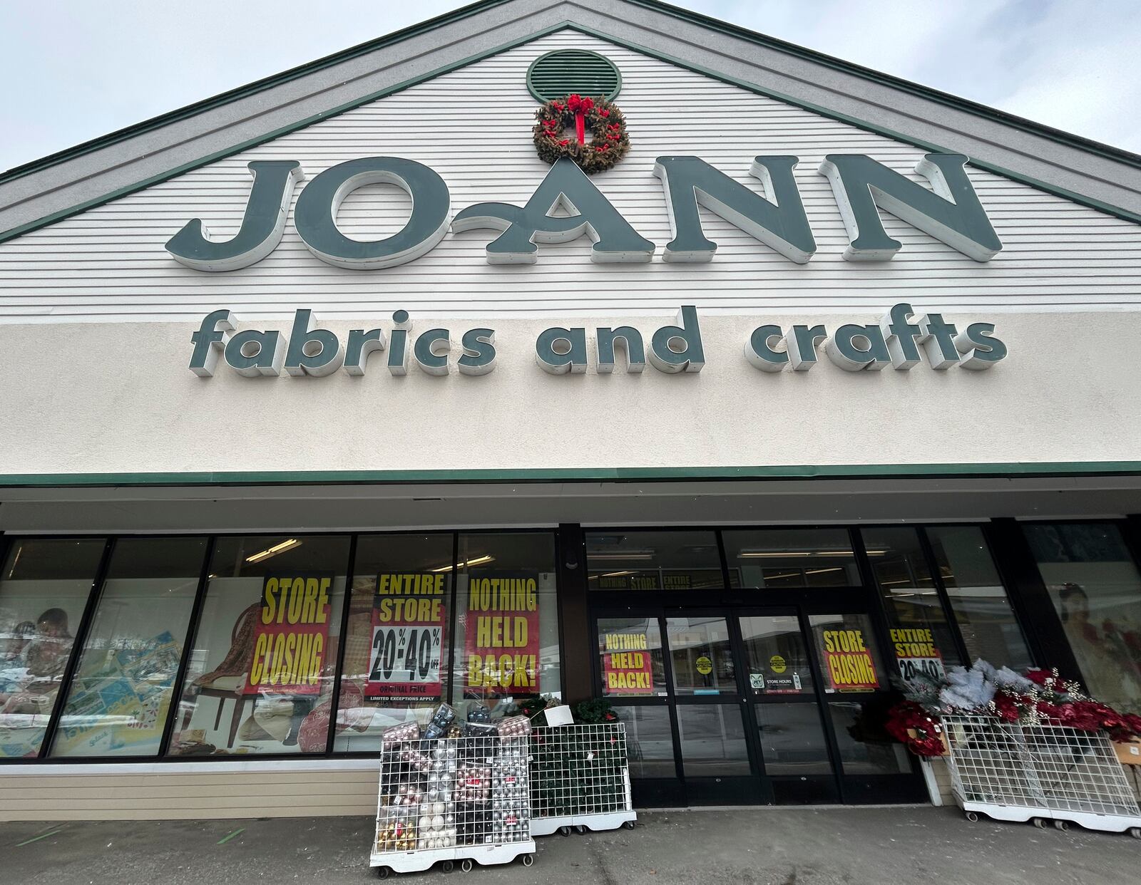Store closing signs appear in the window at a Joann Fabric and Crafts store in Barre, Vt., on Saturday, March 8, 2025. (AP Photo/Carolyn Lessard)