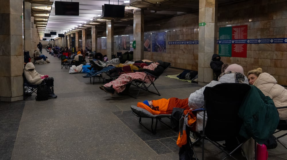 People take shelter in a metro station, being used as a bomb shelter, during a Russian drones attack in Kyiv, Ukraine, Tuesday, Feb. 3, 2026. (AP Photo/Alex Babenko)