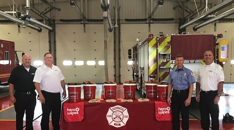 From left, Capt. Jon Harvey, Chief Paul Lolli, Deputy Chief David Adams and Assistant Chief Thomas Snively stand with some of the items the Middletown Division of Fire received from a Firehouse Subs grant. SUBMITTED PHOTO