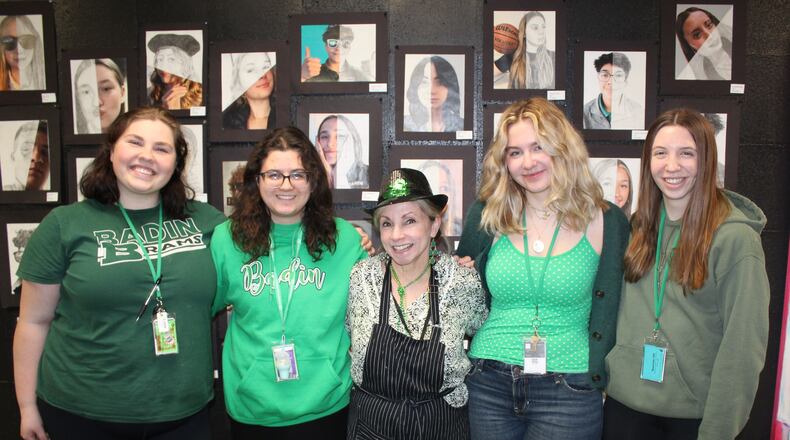 Four Badin High School artists flank Fine Arts chair Sarah Daniels after earning awards at the annual "Tomorrow's Artists Today" competition at the Middletown Arts Center. From left are senior Liz Debbane, junior Jaydah Jones, Mrs. Daniels, senior Elizabeth Carruthers and senior Mia Siefert. Carruthers earned a first-place ribbon in painting while Jones added a second place in drawing. Debbane and Siefert added honorable mention ribbons as 11 Badin students had art juried into the event. (Provided)