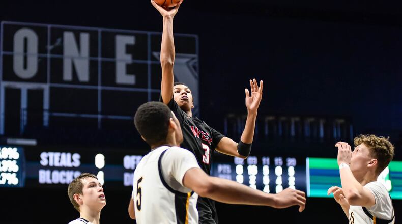 Lakota West’s Julian Mackey puts up a shot during their game against Centerville. Centerville defeated Lakota West 48-40 in their Division I District basketball final Sunday, March 8, 2020 at Xavier University’s Cintas Center. NICK GRAHAM / STAFF