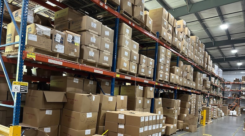 Shelves are lined with products at Crane Consumables in Monroe. RICK McCRABB/CONTRIBUTOR