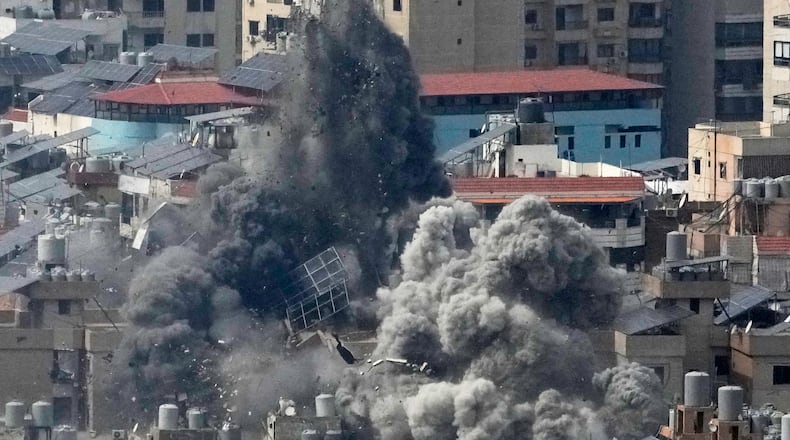 Smoke rises following an Israeli airstrike in Dahiyeh, Beirut's southern suburbs, in Beirut, Lebanon, Friday, March 6, 2026. (AP Photo/Hussein Malla)